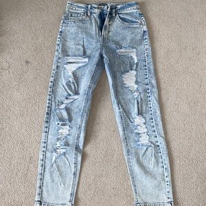 HARDLY WORN: high rise ripped mom jean.